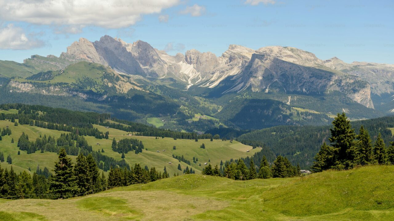 A valley view with lush greenery and mountains.